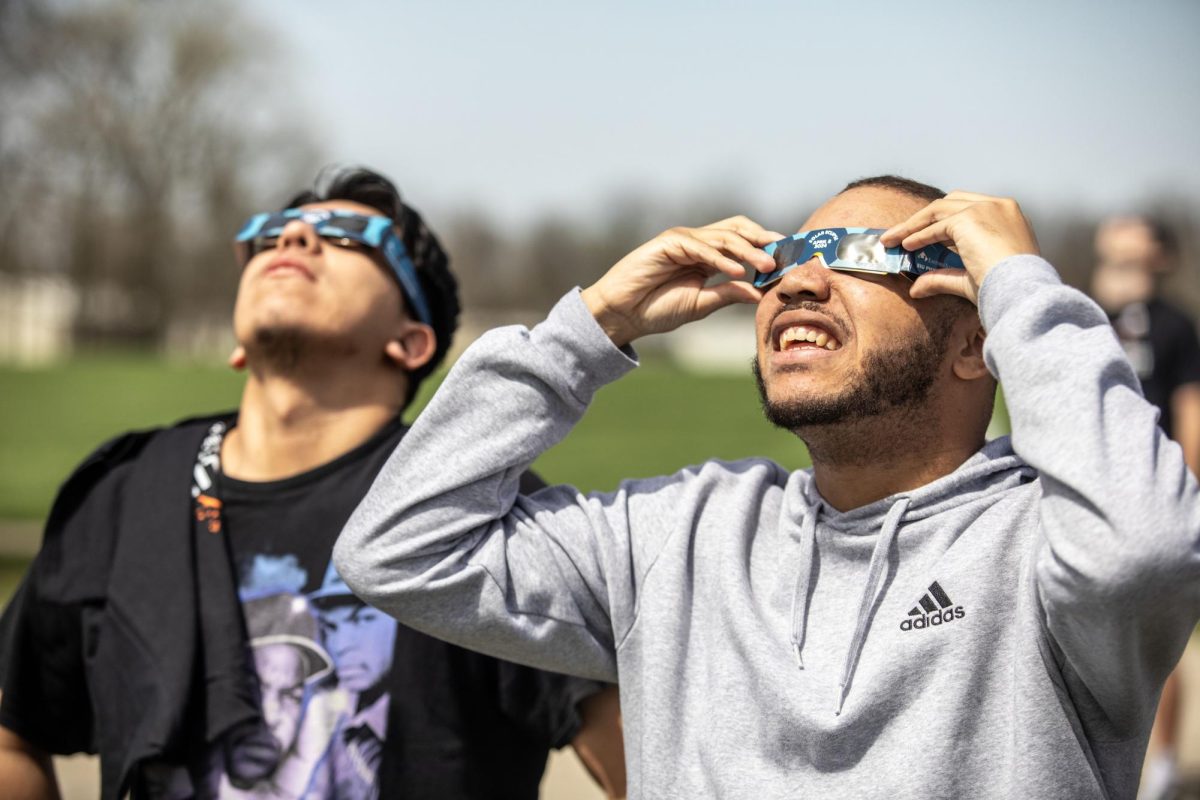 Micah Cherry, a junior criminology/criminal justice major, tests his solar eclipse glasses ten minutes before the eclipse Monday afternoon at the campus observatory.