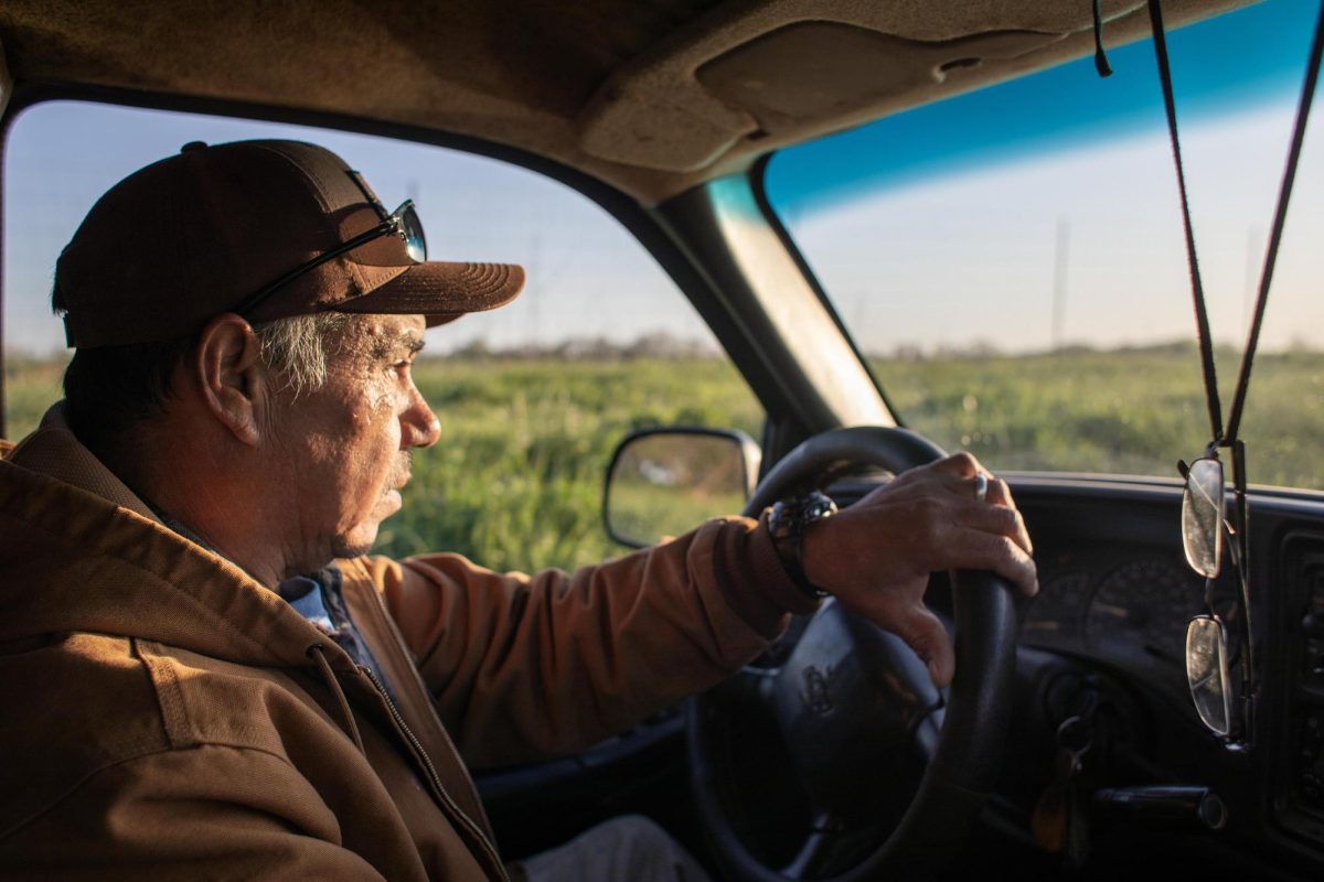 One of the managers, Juan Vicente, follows the worker van to the strawberry fields with his pickup truck on the first day of strawberry season at Flamm Orchards in Cobden, Illinois, Saturday morning, April 13, 2024. Vicente has worked at Flamms since he was 15 around 40 years ago.