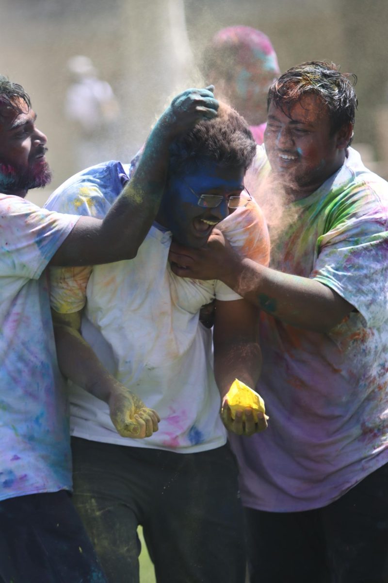 Students celebrate EIUs unofficial Holi in the Library Quad. Holi is a festival celebrated in India. It is celebrated as the festival of colors, love and spring. 