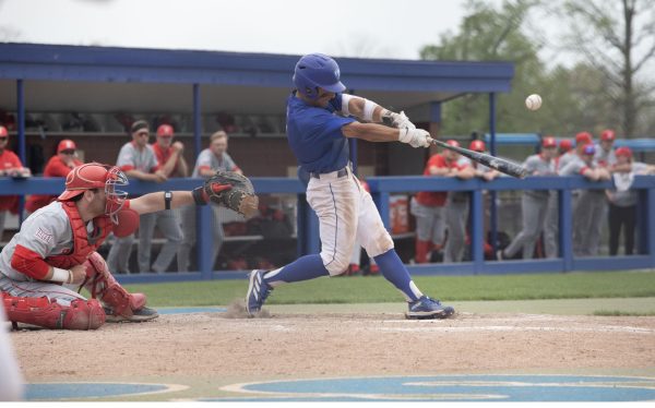 Junior outfielder Quade Peters swinging and hitting the ball during Easterns game against Bradley University on Tuesday,