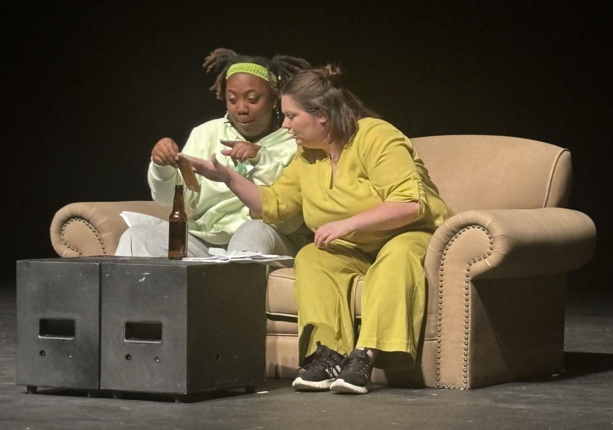 Emerson Gausmann (right) and Kaumi Stuart (left) perform as the party crashes in a short play titled The Party during the New Works Symposium on Friday night April 19,2024. 