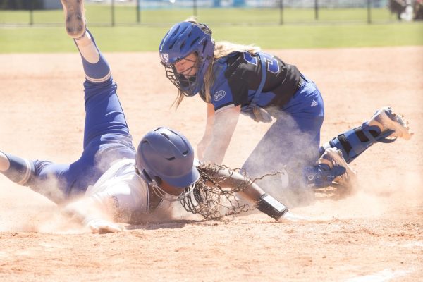 EIU softball players tags out a Tennessee State University player during their doubleheader game at home Saturday. 