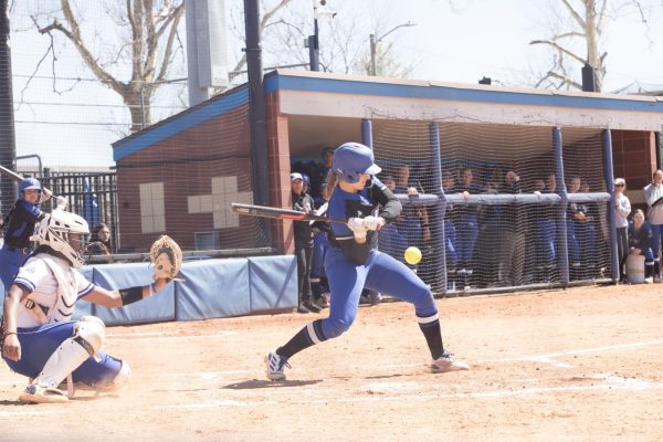 Sophomore infielder, Kendall Grover swings and misses the ball during the Eastern Illinois University softball game against Tennessee State.