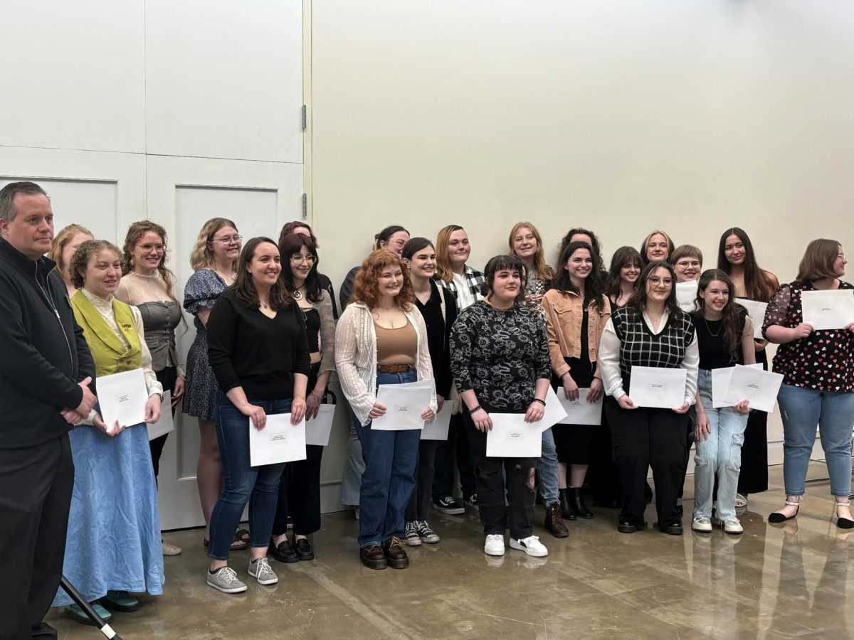 The undergraduate award recipients of Tarble Art Centers Spring Exhibition Cycle Opening stand together for a picture Saturday afternoon.