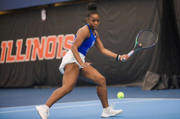 Sophomore Aleyla Wooten bite her lip while hitting the ball over to the other team during the doubles against Southeast Missouri State University Redhawks
She also played singles 