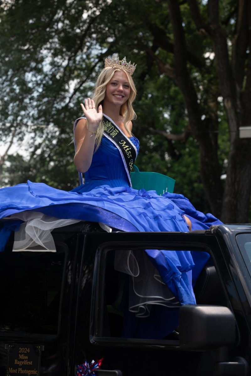 2024 Miss Bagelfest Alisson Gouveia waves to the crowd during the Charleston 4th of July Parade Polk Ave in Charleston, IL on July 4.