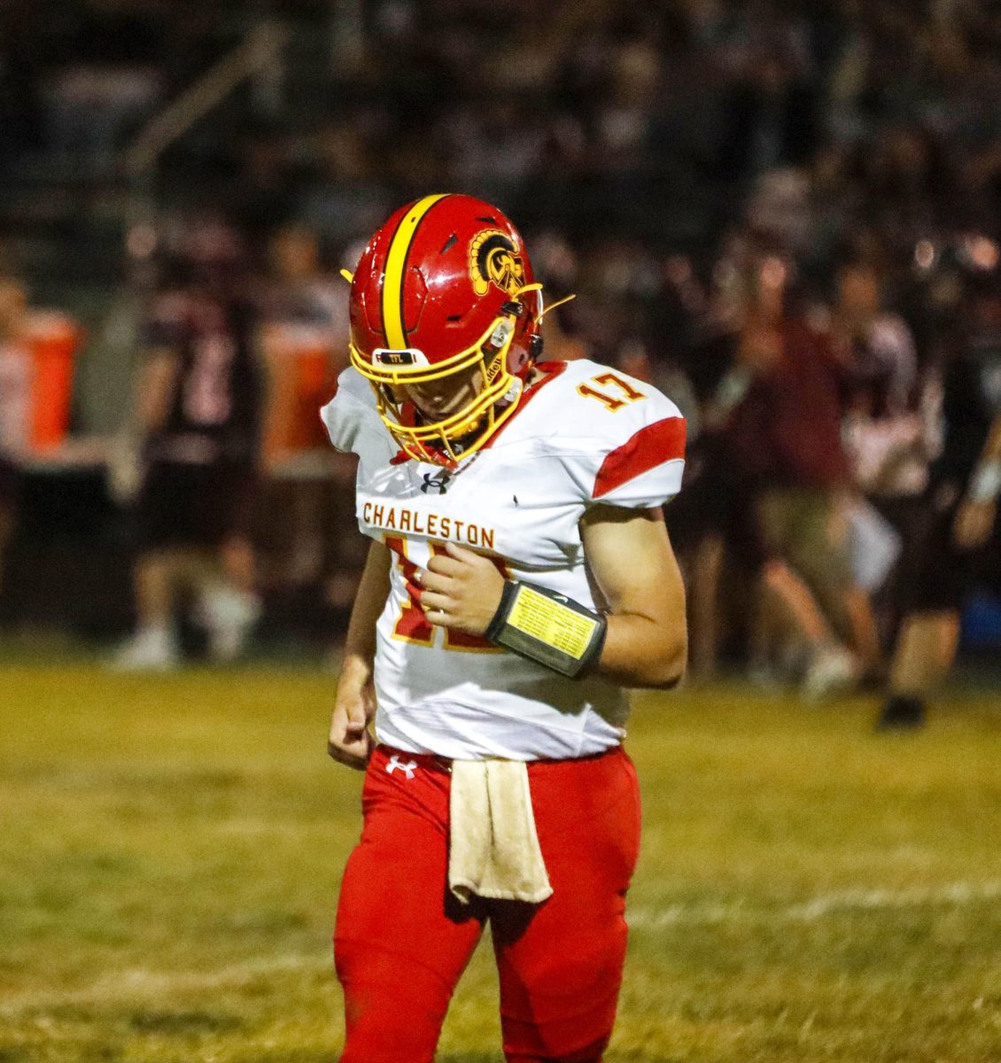 Charleston High School junior quarterback Wyatt Gordon jogs off the field after a drive in the Trojans opening game of the 2025 season as Charleston went on to lose 41-6 to Robinson High School at Crosby Field on Friday.