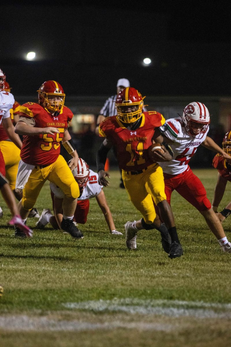 Charleston High School junior running back Treylin Couch runs the ball against Effingham High School as Couch finishes with 264 yards and five touchdowns as Charleston lost 51-35 at Trojan Hill on Friday.
