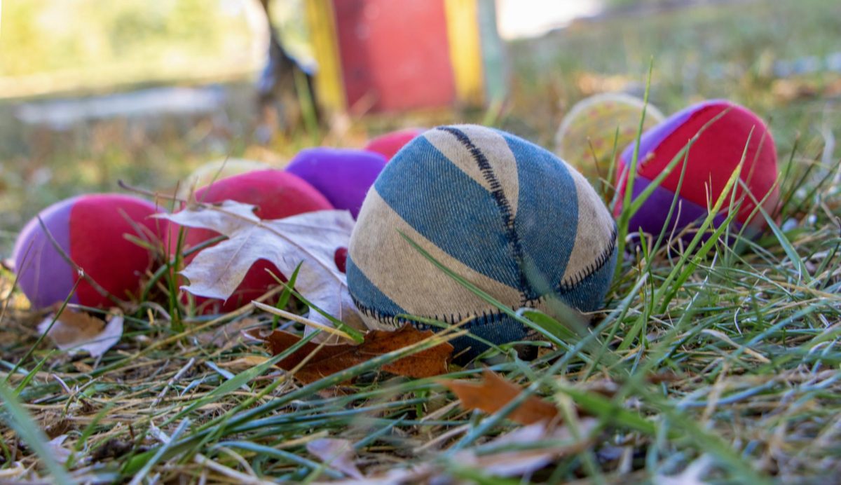 Several soft juggling balls sit at the edge of the Clockwork Clown’s performance ring at Harvest Frolic on Sept. 28, 2025, in Lerna, ILL.