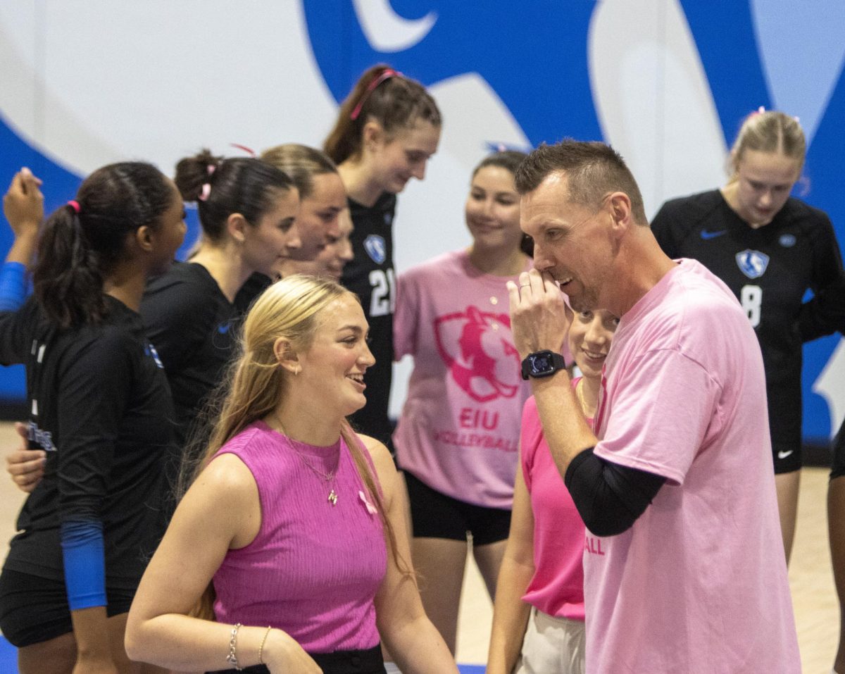EIU volleyball head coach Ryan Millar (right) talks with graduate assistant Kenzie Murray (left) during a timeout in Eastern’s four set victory over Southeast Missouri State at the Gardella Family Court at McAfee gym on Saturday. 