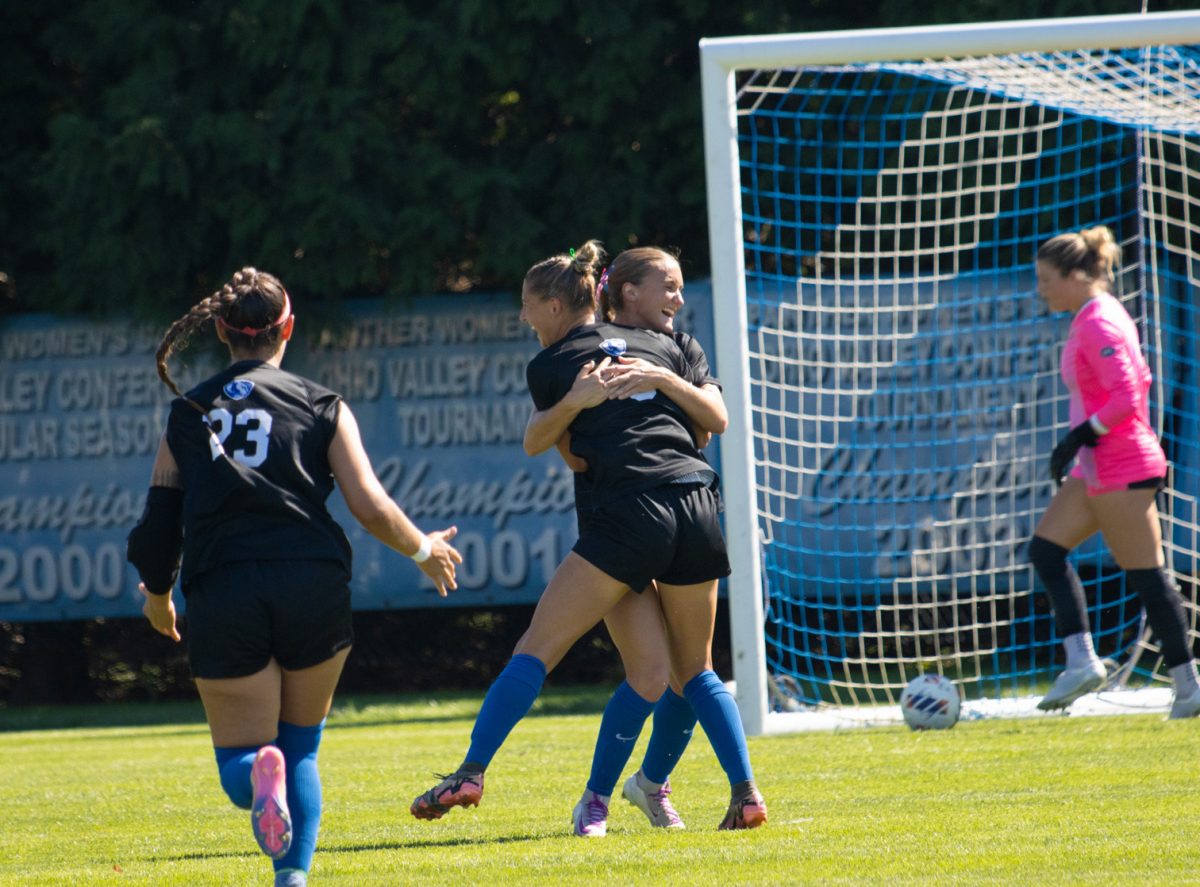 EIU women's soccer junior forward Abby Reinl (6) hugs senior midfielder Kate Germano in celebration after Reinl scored during EIU's 1-0 win over Morehead State at Lakeside Field Sunday.