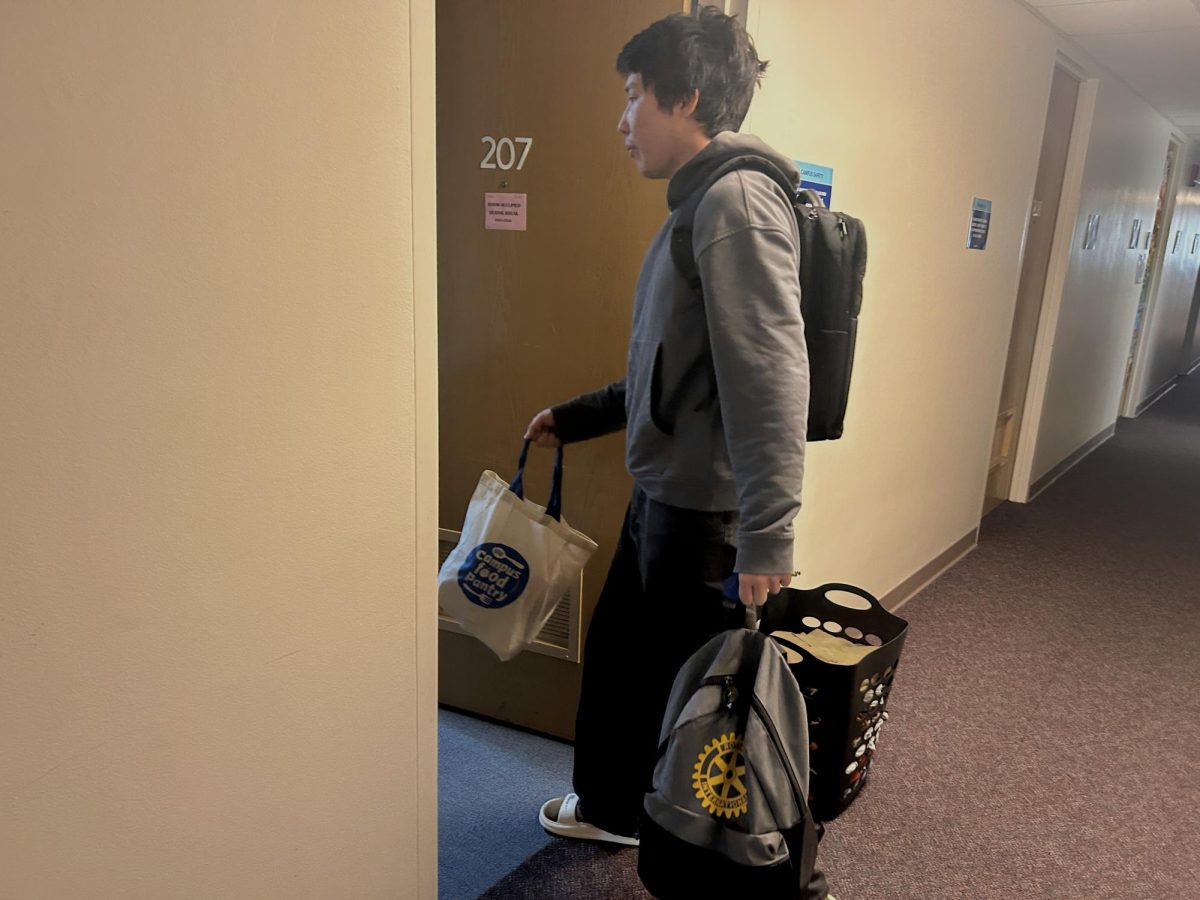 International student Azamat Zhengis from Kazakhstan moves into his new room on the second floor of Lawson Hall during Thanksgiving break.