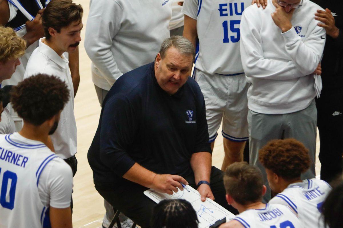EIU men’s basketball head coach Marty Simmons coaches his team during a timeout during Eastern's 65-57 win over Nicholls at Groniger Arena on Friday.