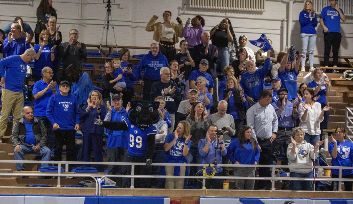 Billy the Panther helps the fans get on their feet before a set point during Eastern volleyball’s 3-0 win against Morehead State at the Gardella Family Court in McAfee gym on Thursday.