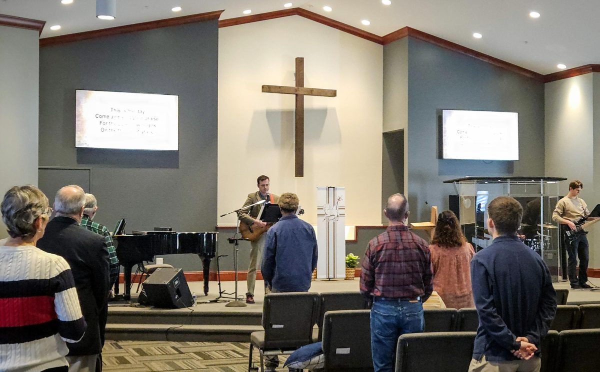 Senior Pastor Jared von Kamp, playing acoustic guitar, and members of the Christ First Church worship team, including Mitchell Cox on the bass guitar, open church service on Nov. 16, 2025, with the playing of a Psalm. The hour and a half service included six songs and a sermon.