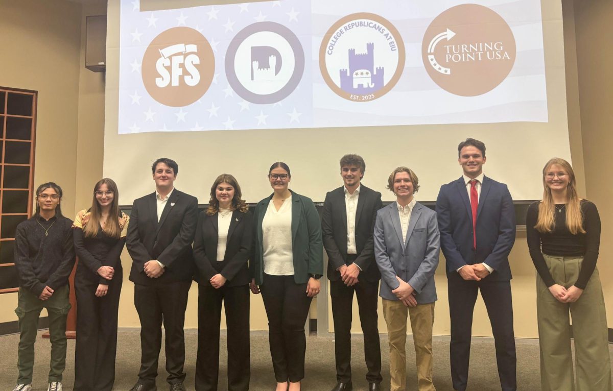 Students for Socialism, EIU College Democrats, EIU College Republicans, and Turning Point USA at EIU representatives line up before the debate night in the Buzzard Auditorium on Tuesday.