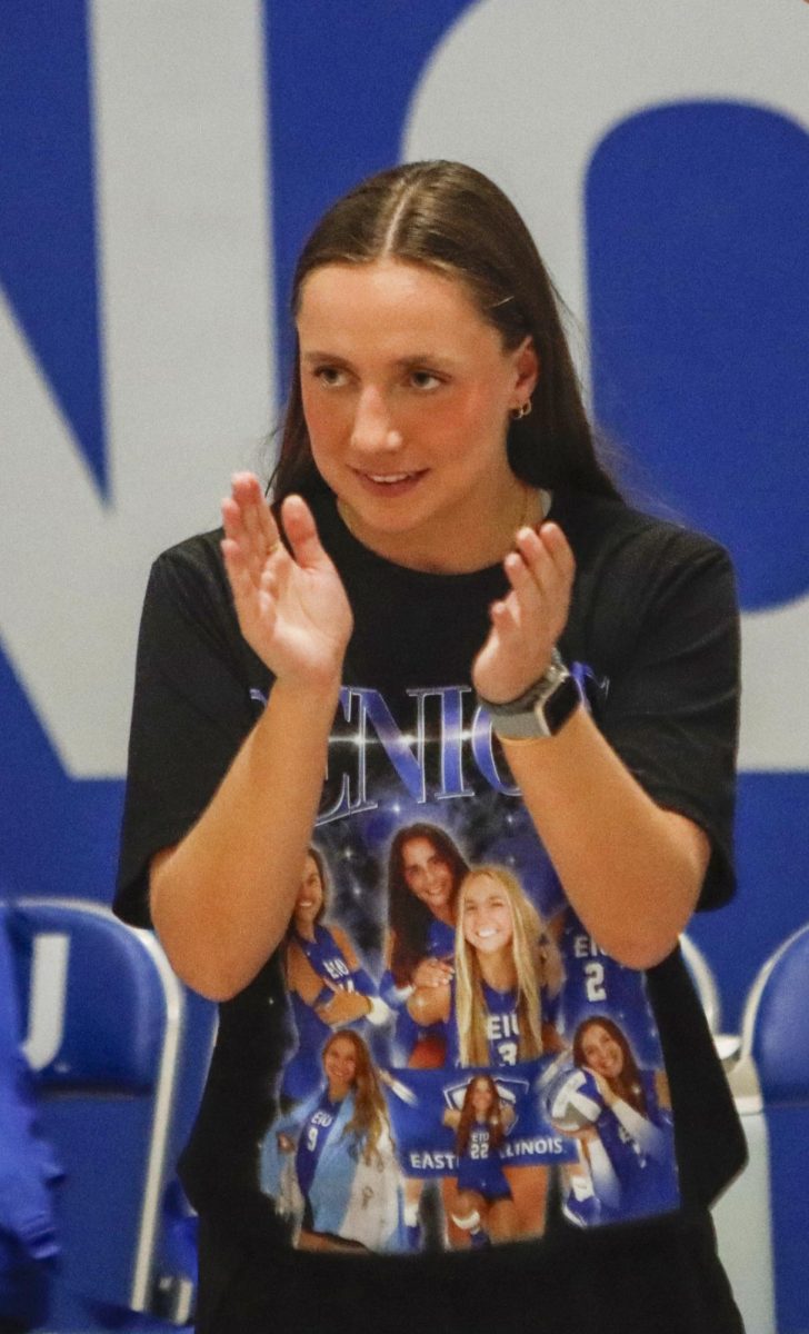 EIU volleyball assistant coach Paige Gardella claps during Eastern’s 3-1 win over Morehead State on Nov. 14.