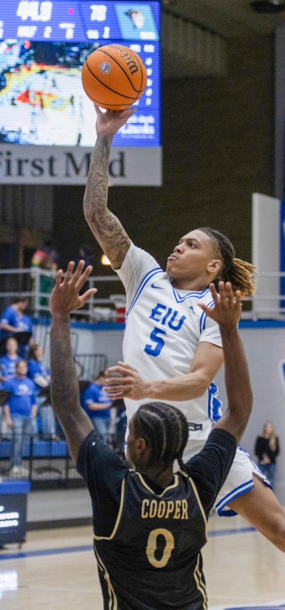 Senior guard Zion Fruster shoots a layup while being guarded by Lindenwood junior Mekhi Cooper during Eastern men’s basketball’s 82-74 loss to Lindenwood at Groninger Arena on Saturday.