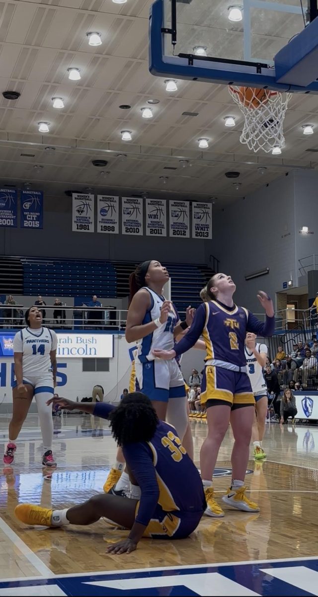 (Thumbnail) Redshirt junior Sydney-James Desroches looks up at her made layup as redshirt junior Meioshe Mason celebrates in the background during EIU's 75-74 win against Tennessee Tech Thursday at Groniger Arena.