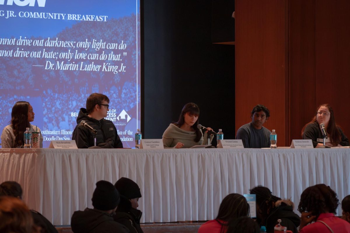 A panel of students began to introduce themselves to the audience. The members of the panel from left to right were Kyla Broadway, Connor Garafano, Krystal Camas, Krishna Daravath and Claire Weber, presidents of various organizations at EIU and Lake Land College. 