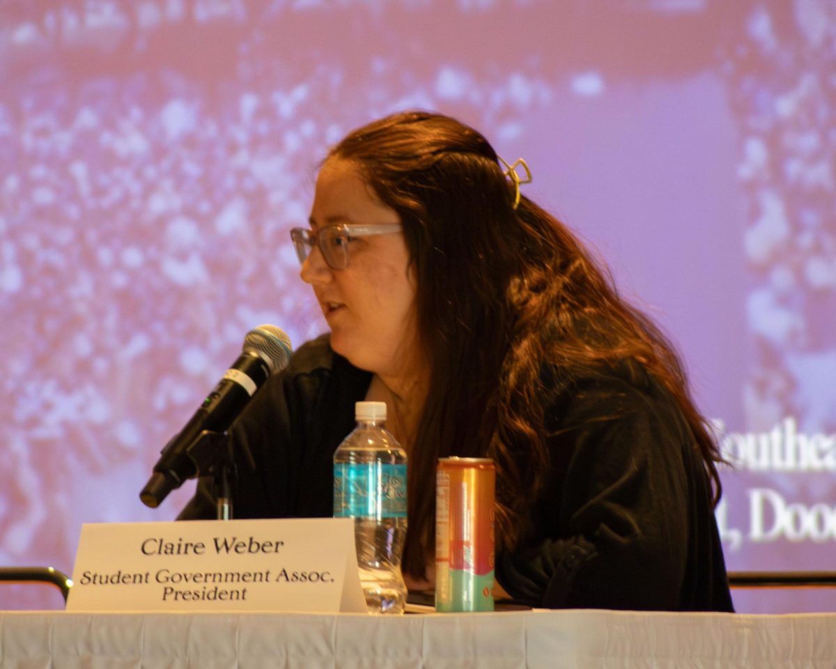 President of the EIU Student Government Association Claire Weber responds to questions relating to student experience and struggles at EIU during the panel segment of the Martin Luther King Jr. community breakfast.