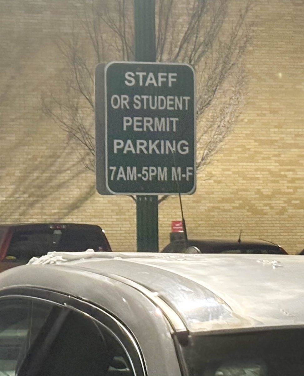 New signs in the south Coleman lot after the parking lot became a staff and student parking lot during winter break.