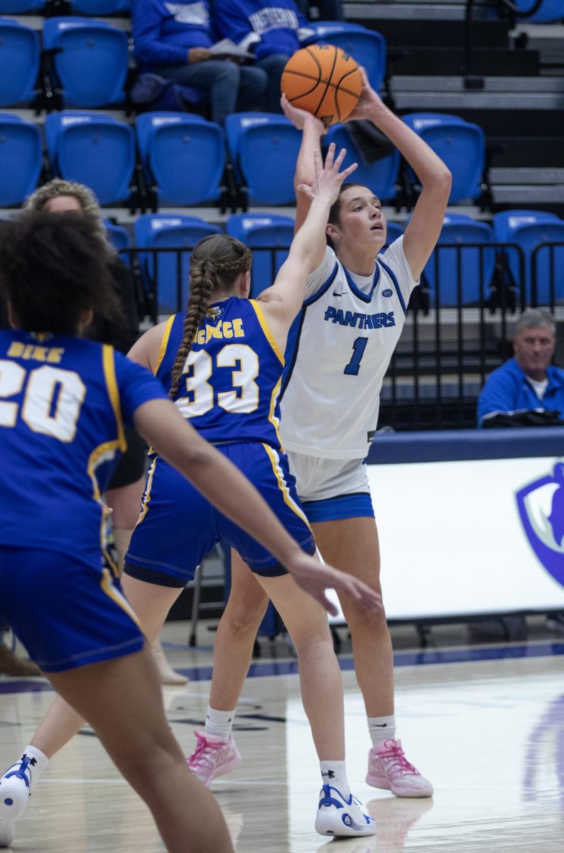 Redshirt junior Ella Lune passes the ball to junior Ava Stoller during Friday's game against Morehead State in Groniger Arena where Lune would score 19 points.