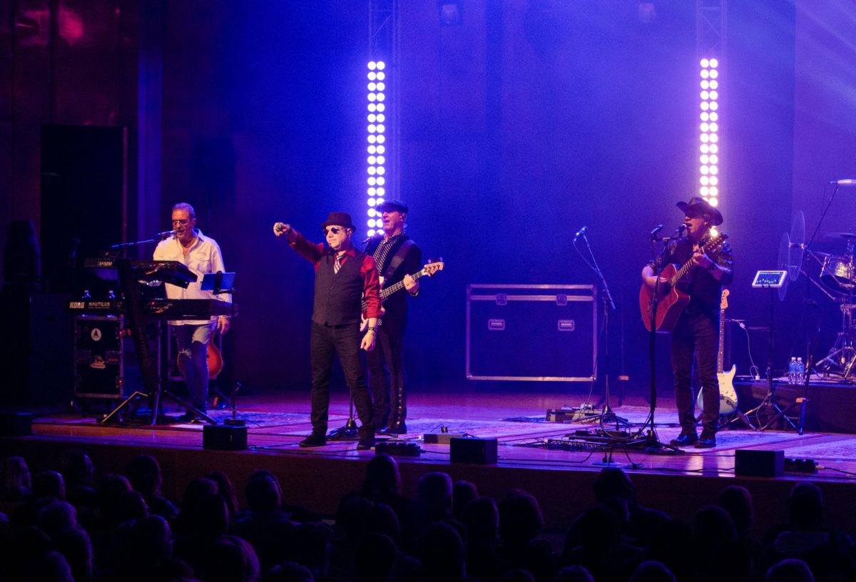 EagleMania plays a song while lead vocalist Marc Hoffman points to the crowd during the EagleMania concert at Dvorak Concert Hall in the Doudna Fine Arts Center on Saturday.