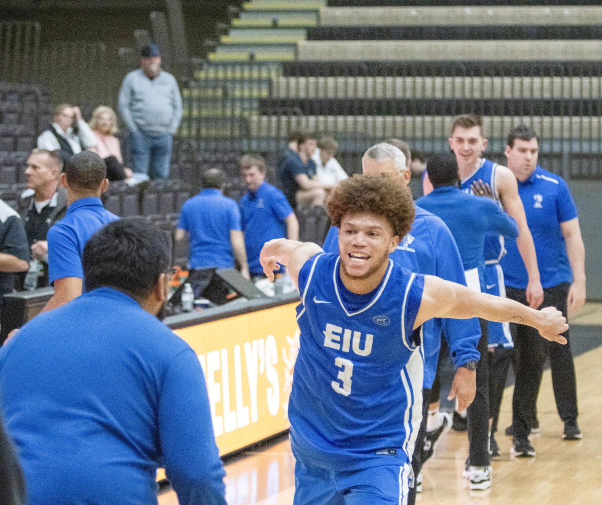 Junior guard Meechie White (right) loads up to jump into assistant coach Carlos Cortez Jr. (left) after EIU men's basketball's 71-67 win over Lindenwood at Hyland Arena in St. Charles, Missouri, on Thursday.