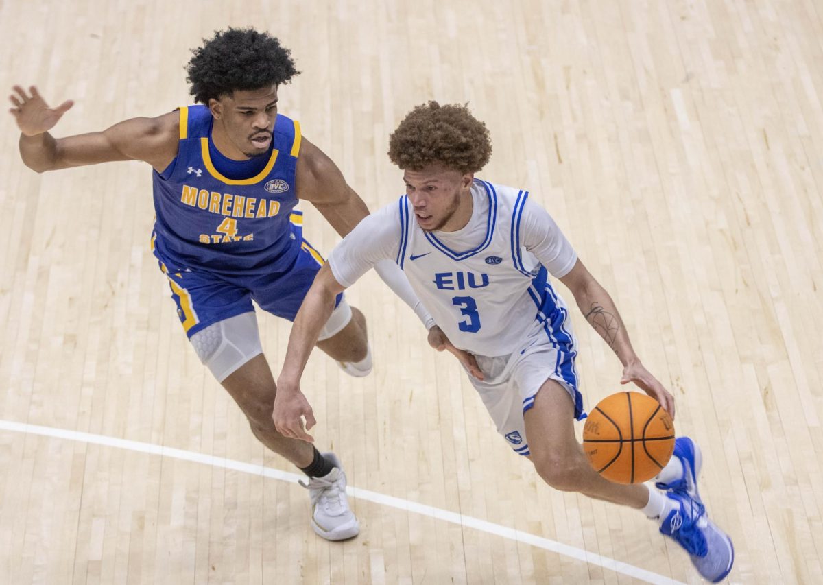 Eastern Illinois men’s basketball Junior Meechie White drives to the basket around Morehead State Defender Jon Carroll during a 73-70 loss to Morehead State at Groniger Arena on Thursday.
