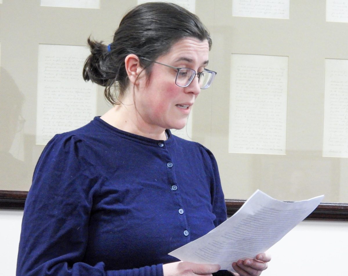 Librarian Michelle McDaniel gives a speech at the EIU student senate meeting on the impact of her non-renewal in the 1895 room of the Martin Luther King Jr. Student Union on Wednesday.