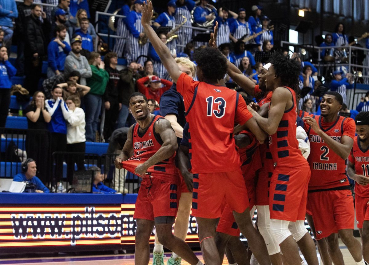 Southern Indiana guard Ismail Habib celebrates with his team after hitting the game winner in EIU men’s basketball’s 70-68 loss to Southern Indiana at Groniger Arena on Saturday.