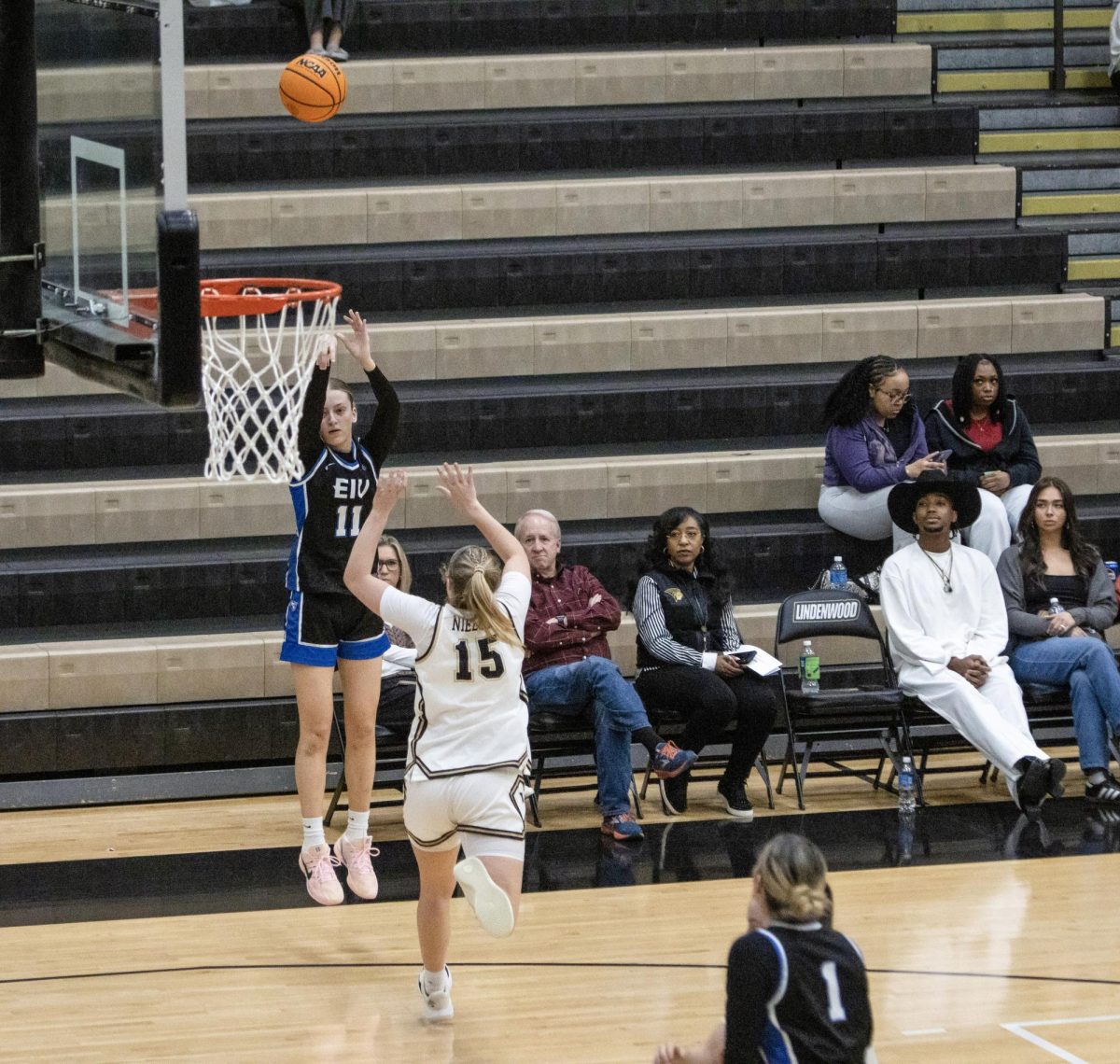 Junior guard Clara Glad shoots a three-pointer over Lindenwood forward Alyssa Nielsen during EIU women’s basketball’s 80-43 loss to Lindenwood at Hyland Arena in St. Charles, Missouri on Thursday.