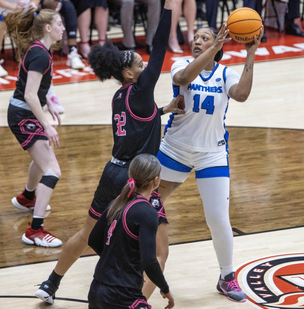  Redshirt junior center Meioshe Mason looks up at the rim before taking a shot from inside the paint against SIUE graduate student forward Syanne Mohamed in the first half of Eastern women’s basketball 70-43 lost against SIUE at First Community Arena in Edwardsville on Saturday.