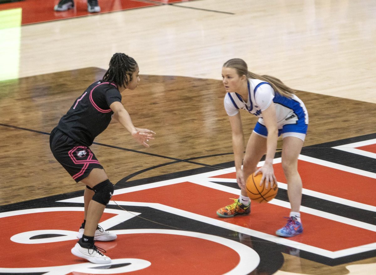 Junior guard Ava toller dribbles face to face with SIUE freshman guard Kiyoko Proctor in the first half of Eastern women’s basketball 70-43 lost against SIUE at First Community Arena in Edwardsville on Saturday.