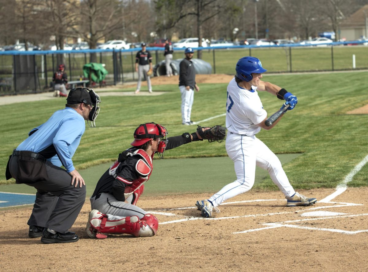 In the game against Northern Illinois University, senior outfielder Ethan Rossi swings the bat as NIU pitcher Connor Mendell catches the ball during the game on Tuesday in Coaches Stadium. The panthers lost 5-4 and Rossi had 4 at-bats.