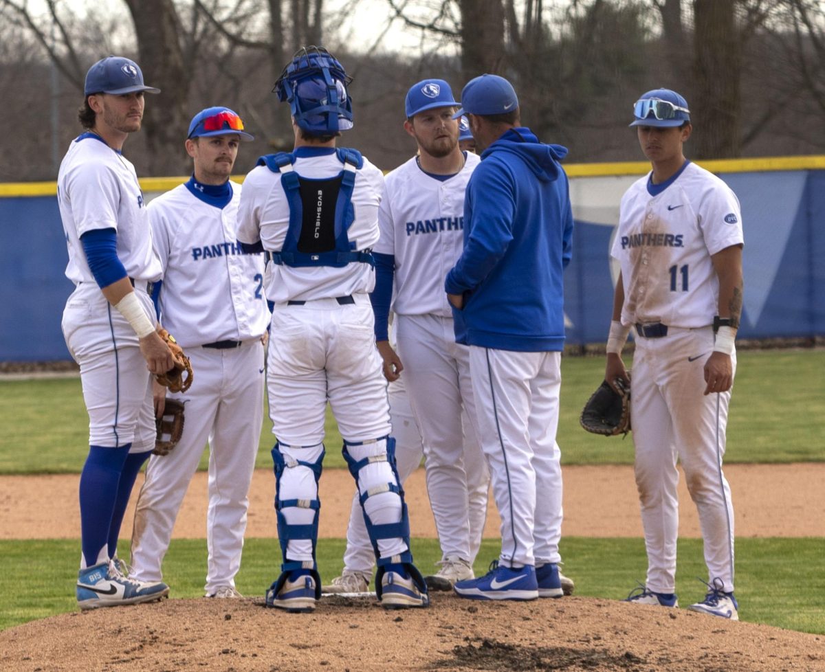 EIU baseball teammates huddle together during the fourth inning of the game against the Northern Illinois University Huskies on Tuesday in Coaches Stadium. The panthers had a 5-4 loss against the huskies.