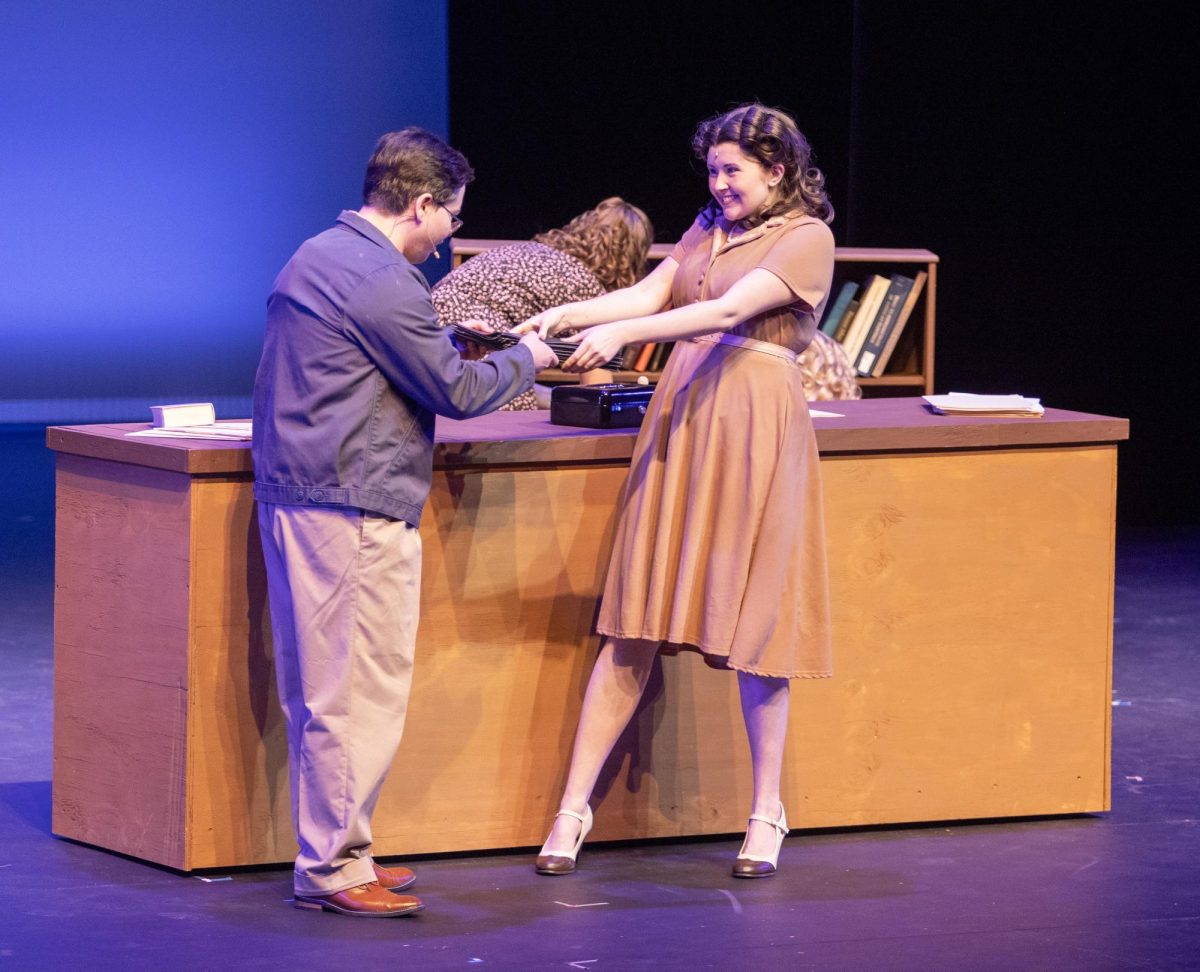 Characters Billy Cane and Margo played by Gentry Copsy and Olivia Enlow have a warm embrace when Billy Cane visits Margo in her new bookstore during the dress rehearsal on Thursday for the musical, Bright Star, in Doudna Fine Arts Center.
