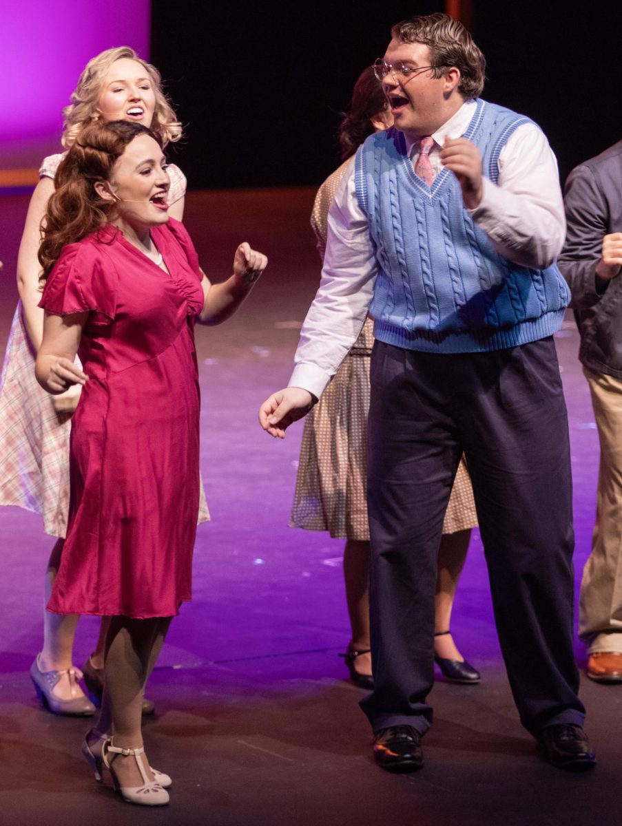 Lucy played by Ellis Mansfield (left) and Daryl played by Zechariah Underwood (right) dance during the closing song of Bright Star during dress rehearsal on Thursday, Feb 26. in Doudna Fine Arts Center.