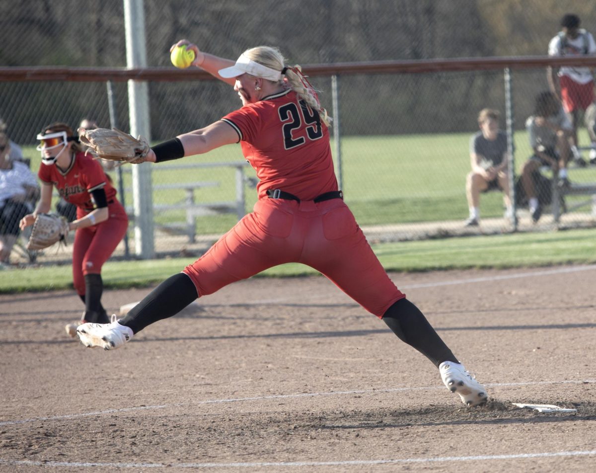 Charleston High School trojan softball pitcher Raylin Cox pitches during the game on Thursday against the Teutopolis High School wooden shoes where CHS would lose 14-4.