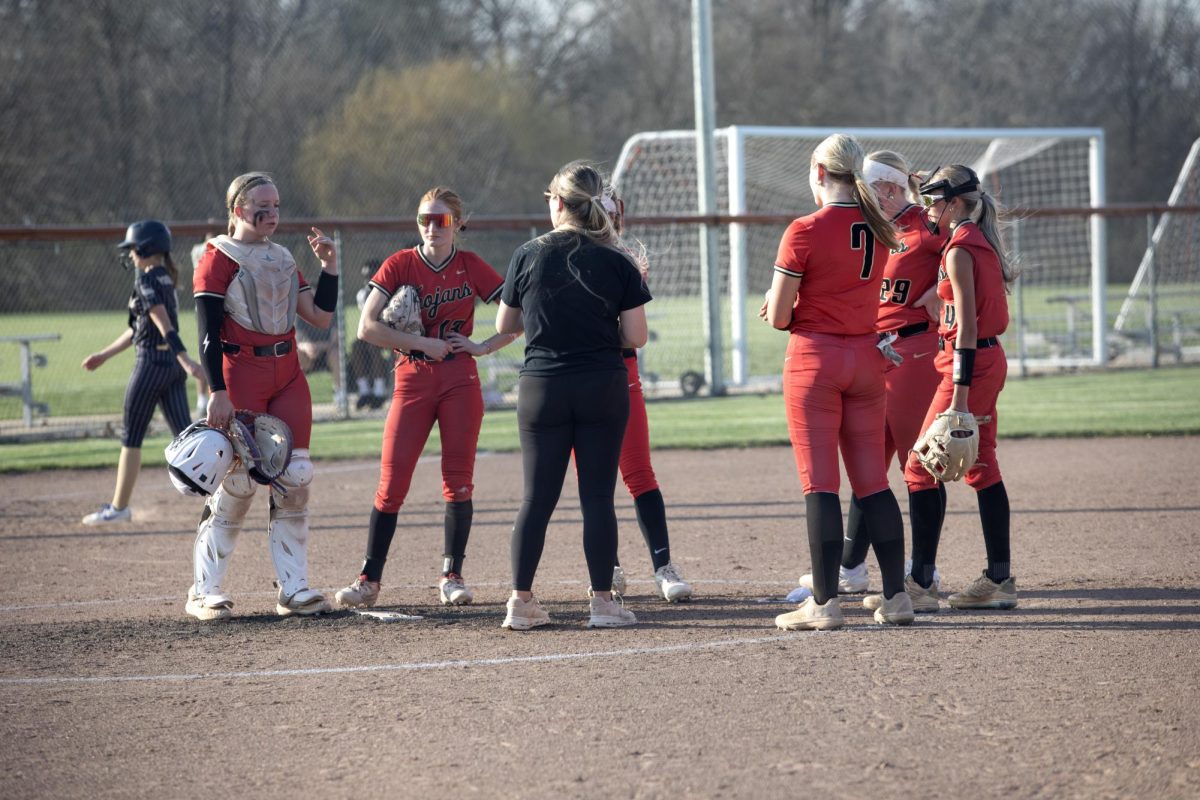 Charleston High School softball trojans huddle during the game on Thursday against the Teutopolis High School wooden shoes where CHS would lose 14-4.