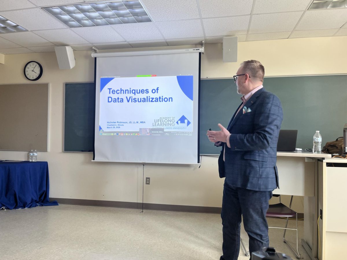 Professor of Business Ethics, Nicholas Robinson begins his presentation on data visualization in Buzzard Hall on Thursday which elaborated on how to effectively communicate data to an audience. 