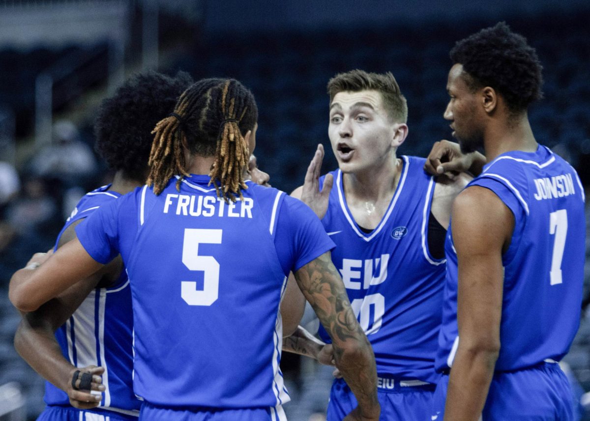 The EIU men’s basketball team huddles up during EIU men’s basketball’s 77-71 win over five-seed SIUE in the OVC conference tournament at the Ford Center in Evansville, Indiana, on Wednesday.