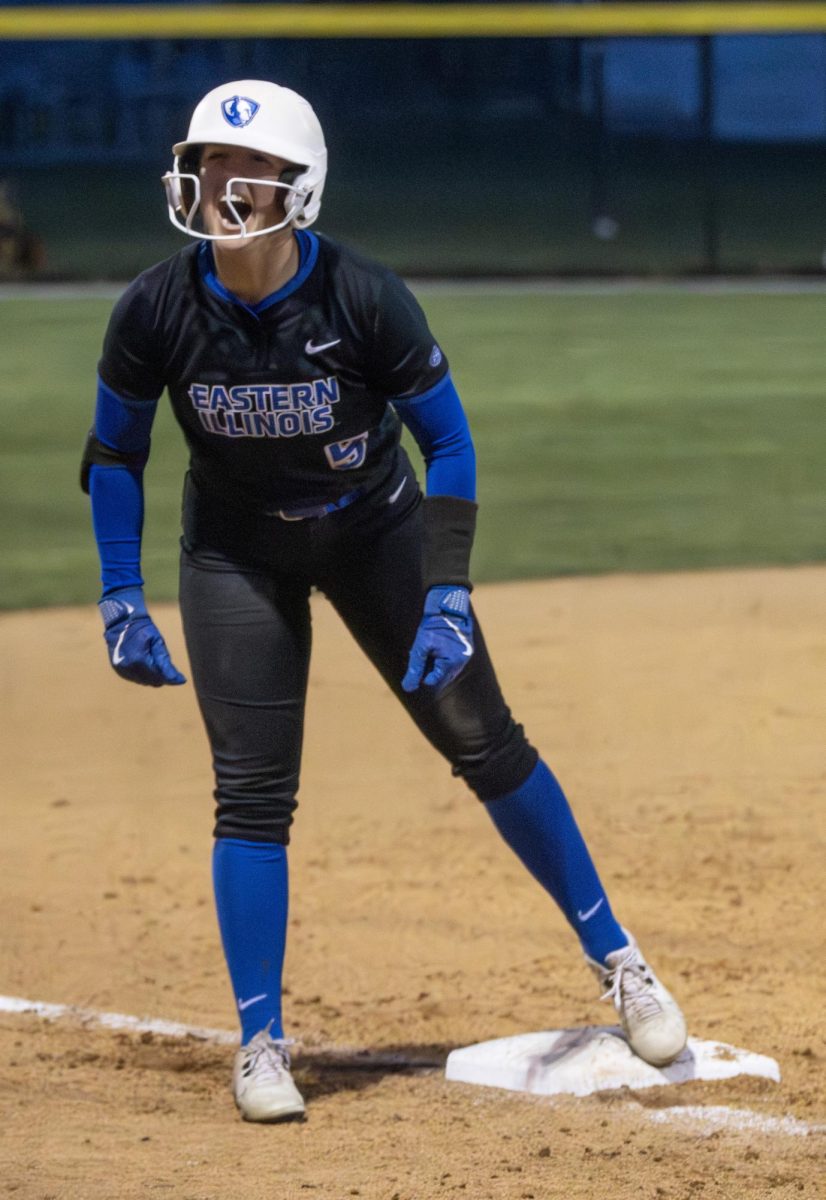  Eastern Illinois softball senior outfielder Marybeth Dyson celebrates towards her dugout after hitting an RBI triple in inning six of a 14 inning 12-11 victory game against Lindenwood on Friday in Williams Field.