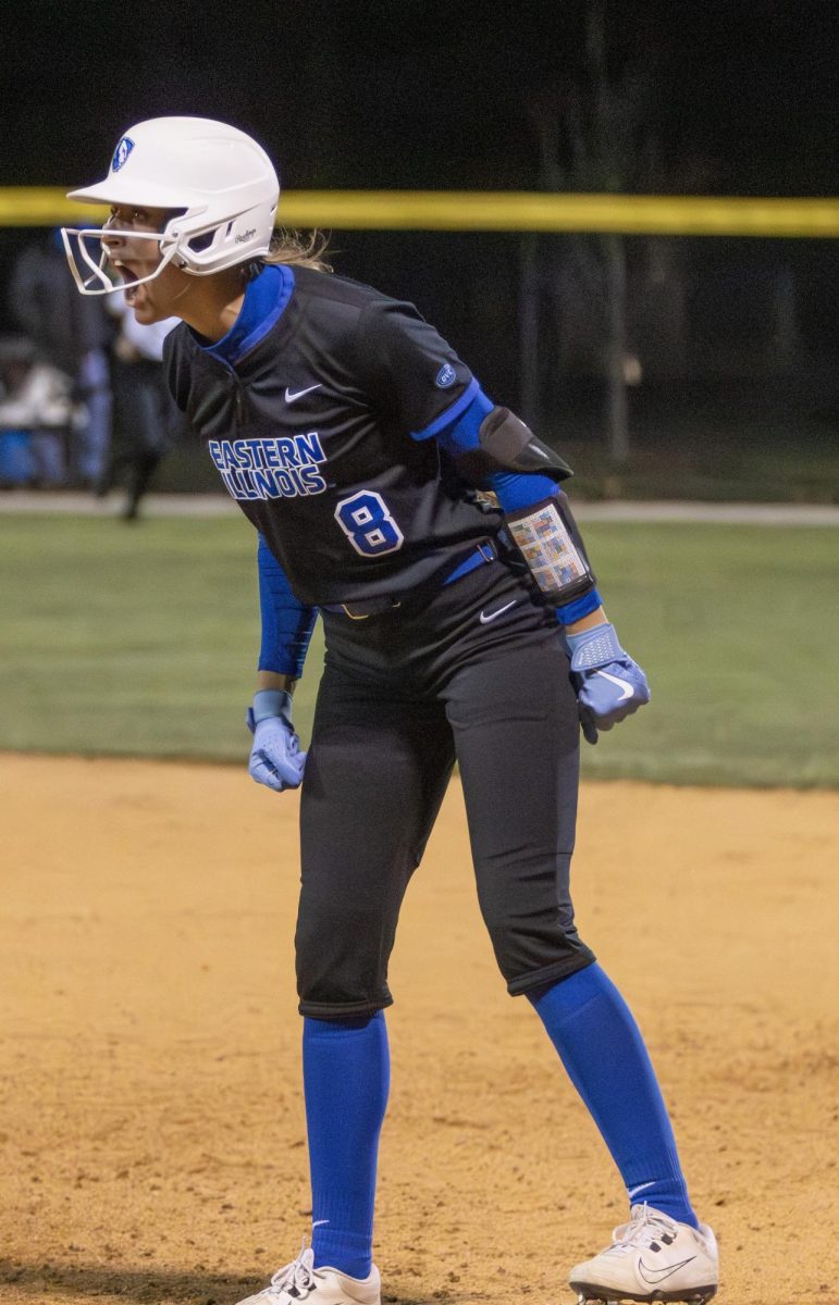 Eastern Illinois softball freshman outfielder Brooklyn Groppel celebrates towards her dugout after getting on base during a 14 inning 12-11 victory against Lindenwood on Friday on Williams Field.