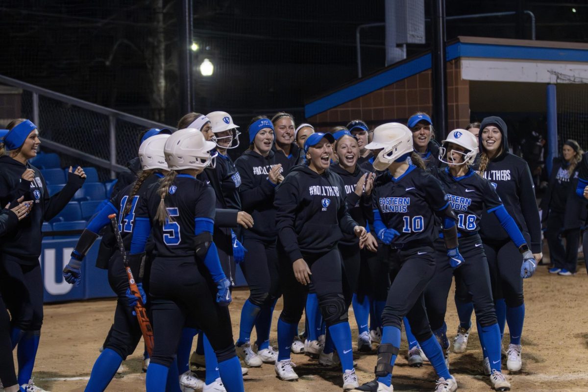 Eastern Illinois softball junior catcher Sophia Olmon celebrates with her team after hitting a two-run game tying homerun in the Friday in Williams Field.