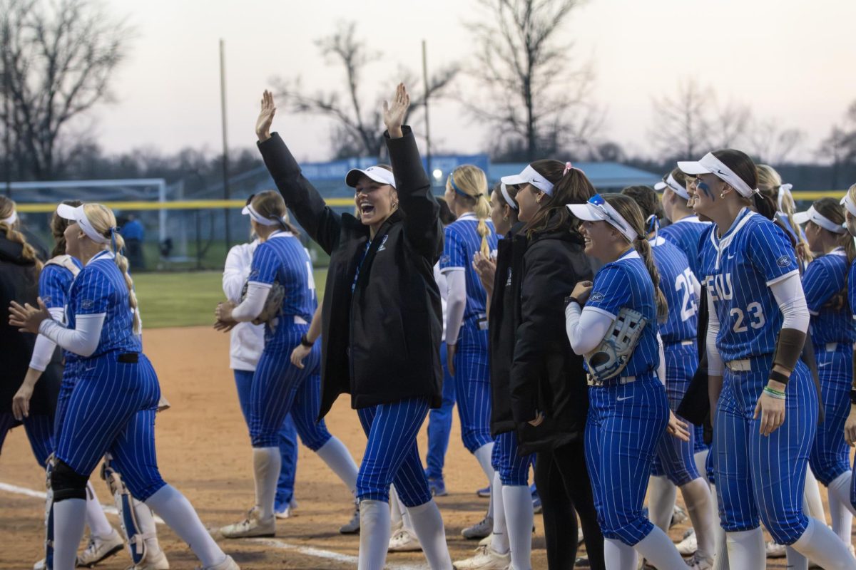 EIU softball junior catcher Sophia Olman celebrates after the second game win of the day against Lindenwood University with her teammates during the 5-1 victory.