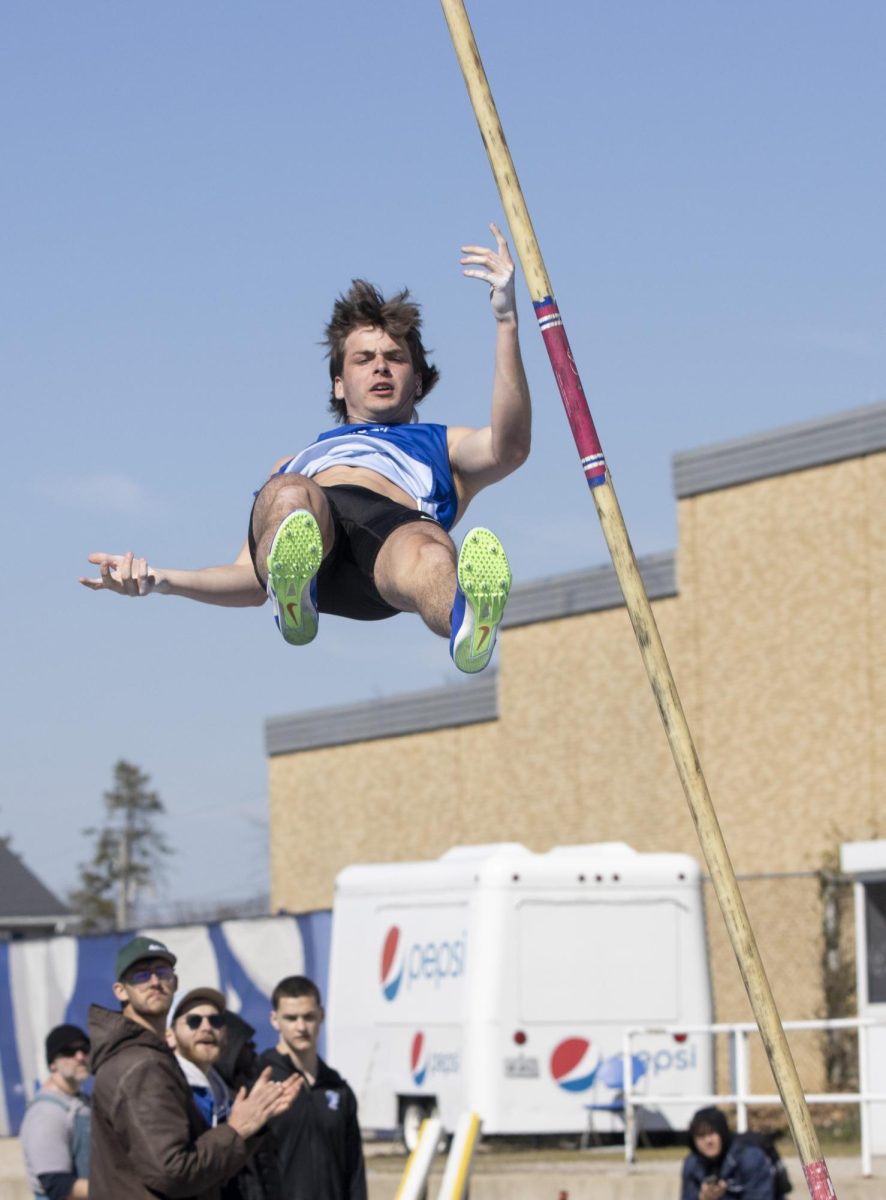 Eastern Illinois University freshman field pole vaulter Gavin Snyder falls into the mat after a successful pole vault at the Big Blue Classic on Saturday.
