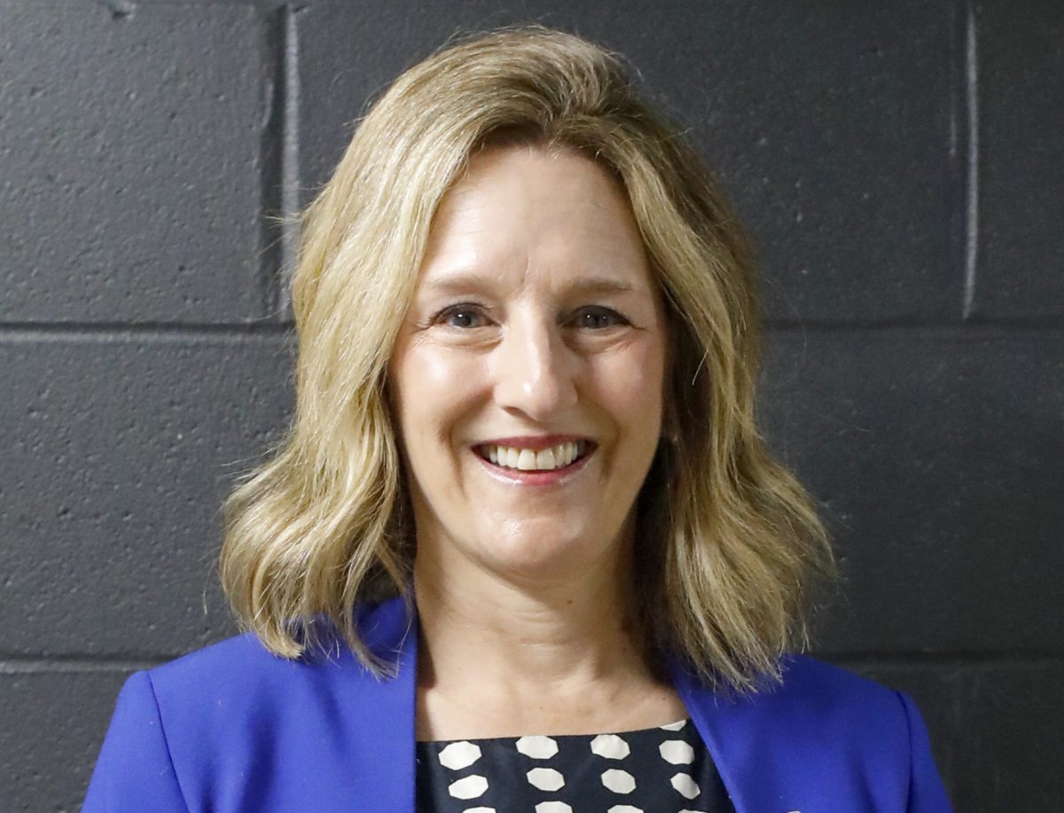 Anne Flaherty poses for a picture in the Doudna Fine Arts Center on Thursday. Flaherty will fill in for the position of Vice President for University Advancement while maintaining her position of Vice President for Student Affairs.