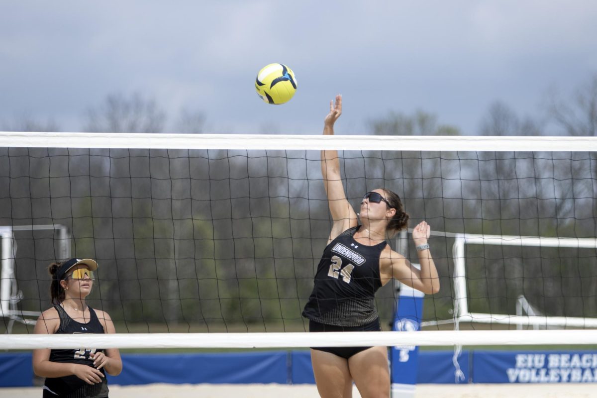 Lindenwood University junior Dixie Farish spikes the ball over the net during the beach volleyball game against EIU where the panthers would lose 4-1 on Friday at Linder Sports Complex.